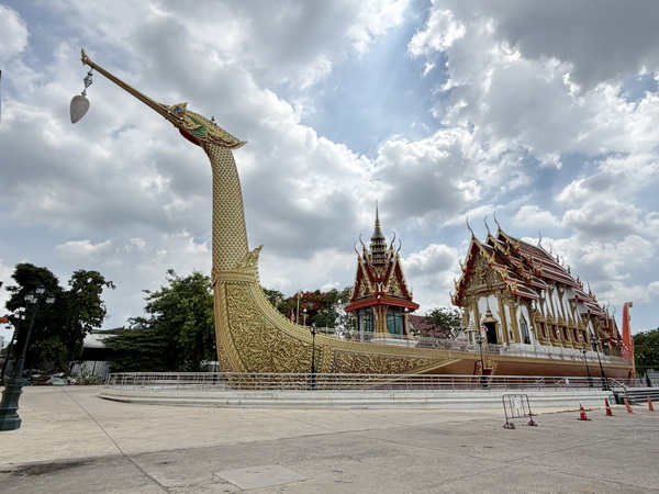 Unique golden catamaran-inspired temple along the canal, inspired by the story of Noah's Ark