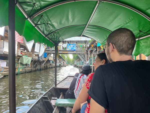 Scenic boat ride through Bangkok's old canals during the floating markets tour