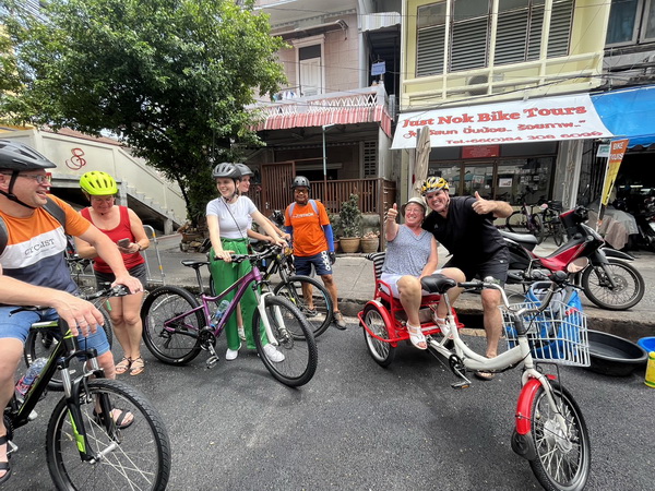 Cyclists meeting at the Just Nok Bike Tours shop before the Wonders and Mysteries tour