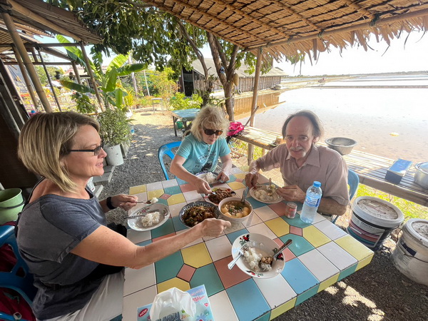 Group enjoying lunch at a local open-air restaurant by the salt pans