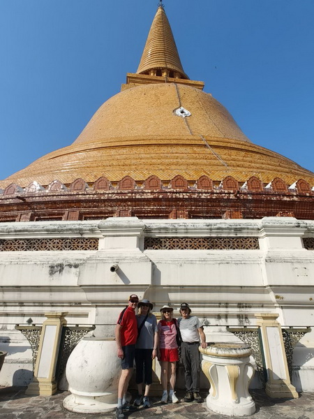 Group photo at the base of Wat Phra Pathom Chedi, showcasing its massive scale