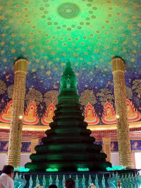 The spectacular neon painted jade stupa and dome inside Wat Paknam Phasi Charoen