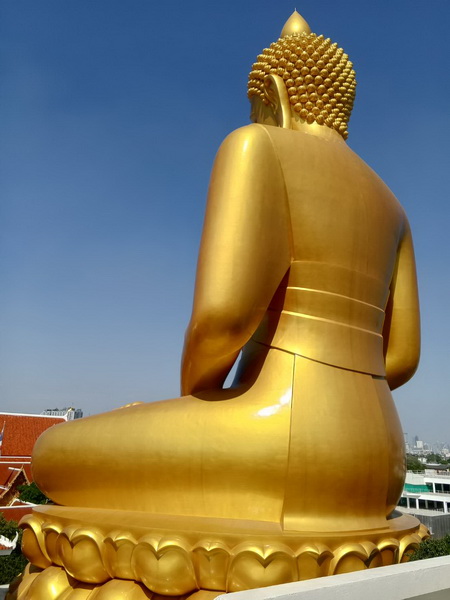 View of the giant golden Buddha from behind at Wat Paknam Phasi Charoen