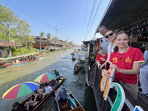Tourists enjoying boat trips on the canals at Damnoen Saduak floating market