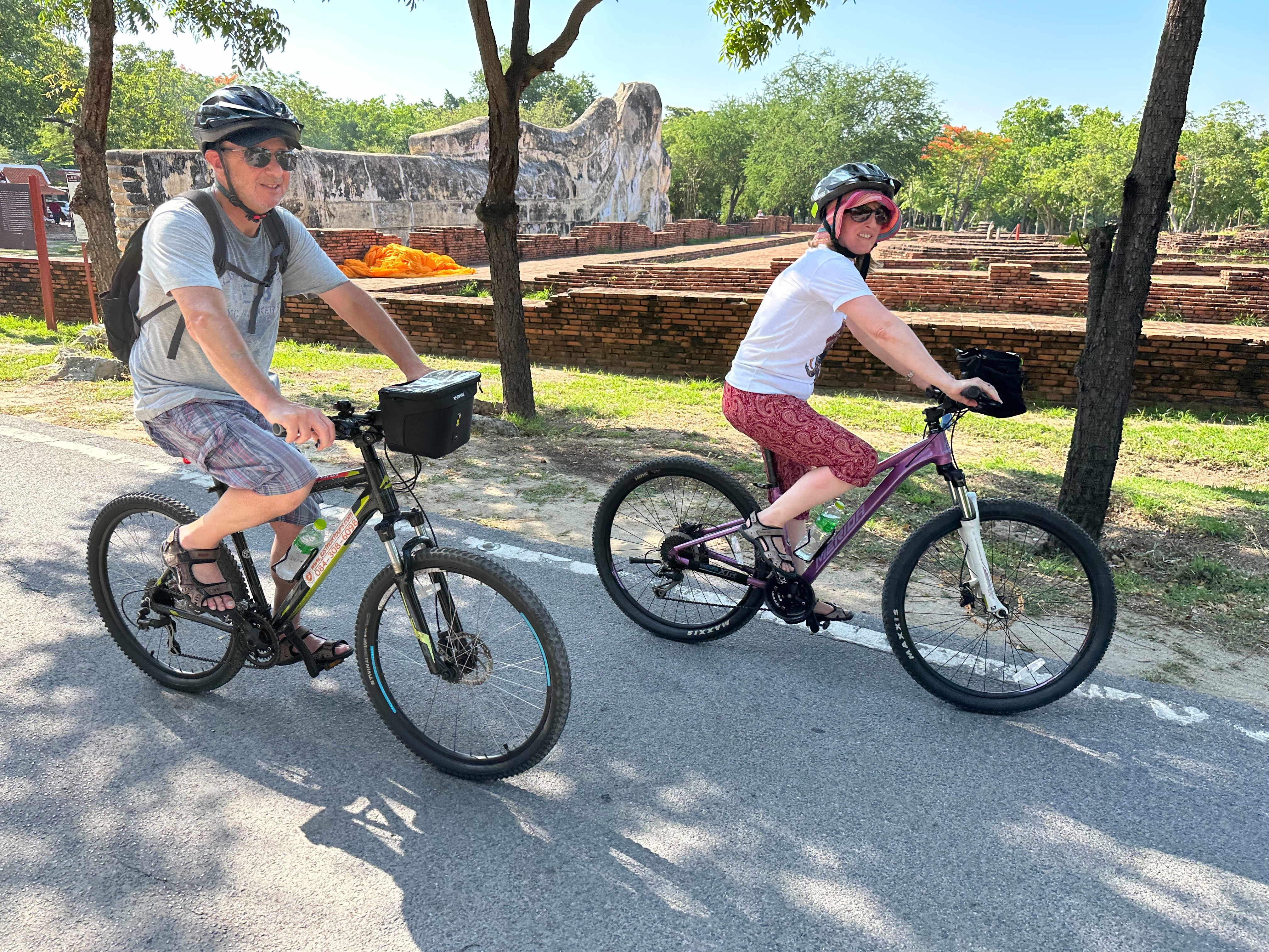 Cycling past historic temple ruins in the ancient capital of Ayutthaya