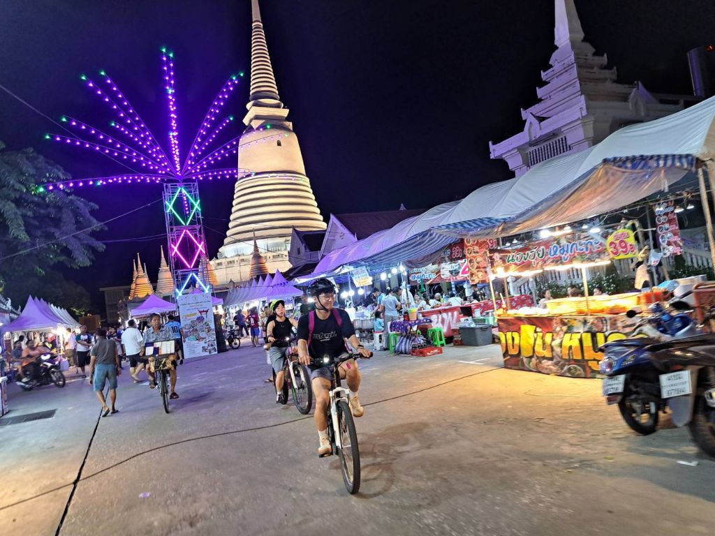 Vibrant Pak Khlong Talat flower market at night with colourful blooms and vendors