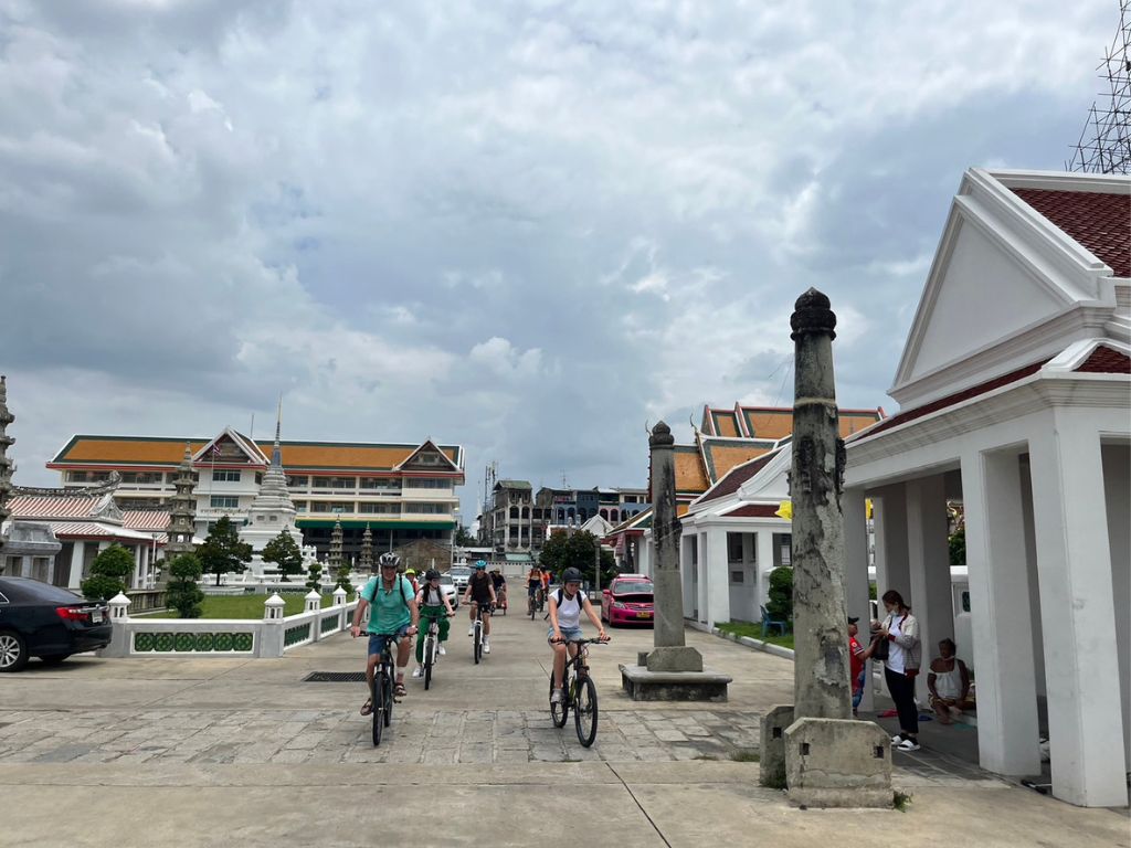 Cycling through temple grounds and exploring Bangkok's cultural heritage by bicycle