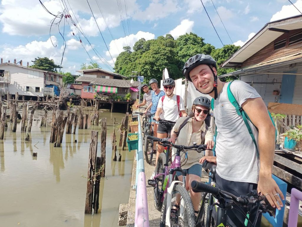 Cyclists discovering hidden Bangkok temples and mysterious historical sites on Wonders and Mysteries tour