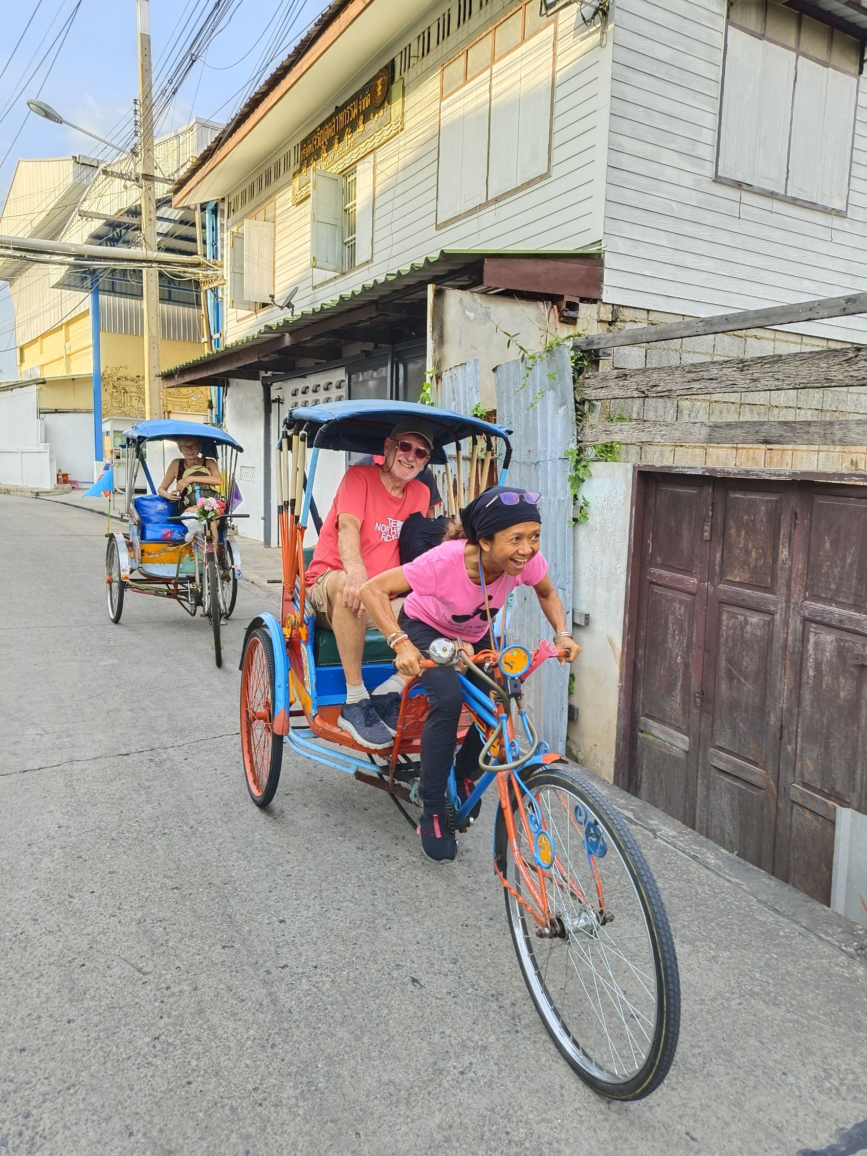 Traditional sam lor three-wheeled taxi ride along Bangkok canals