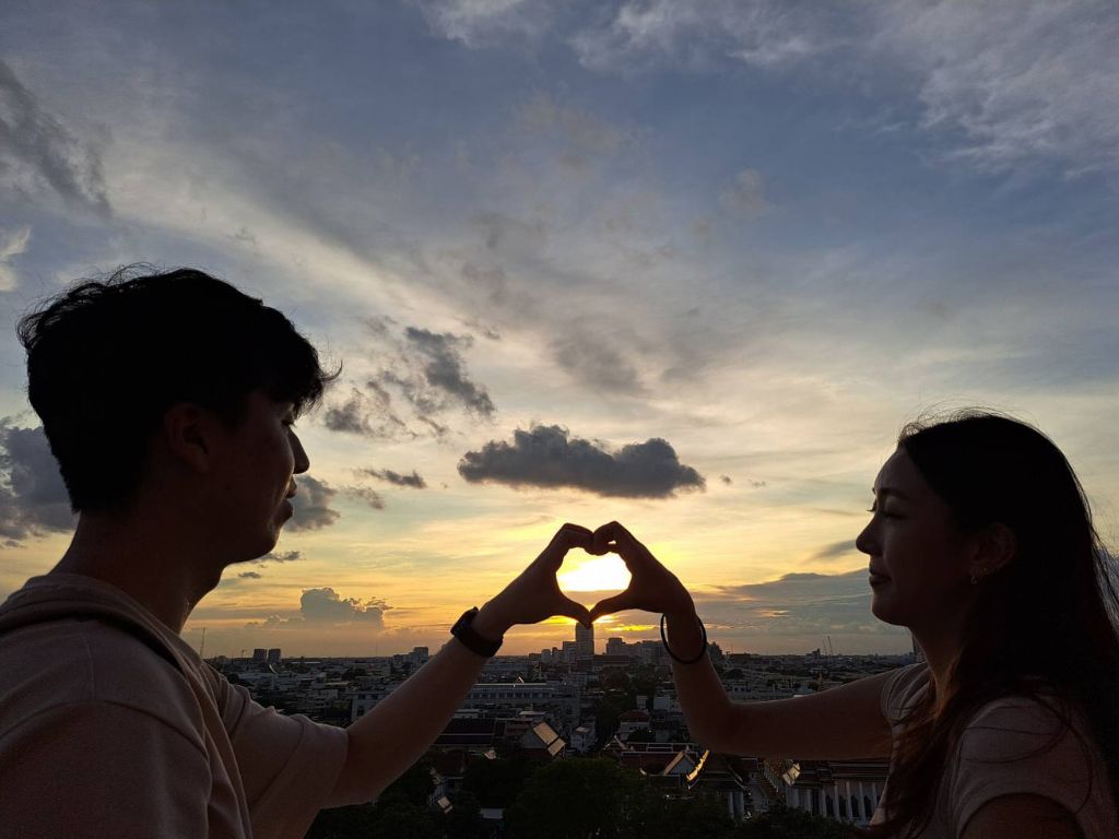 Panoramic sunset view from Golden Mountain temple overlooking Bangkok cityscape
